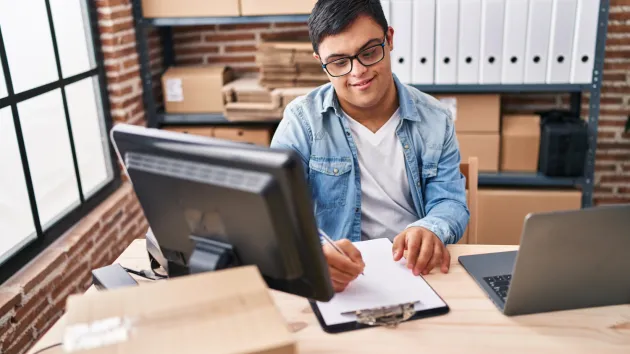 Disabled entrepreneur using a laptop 