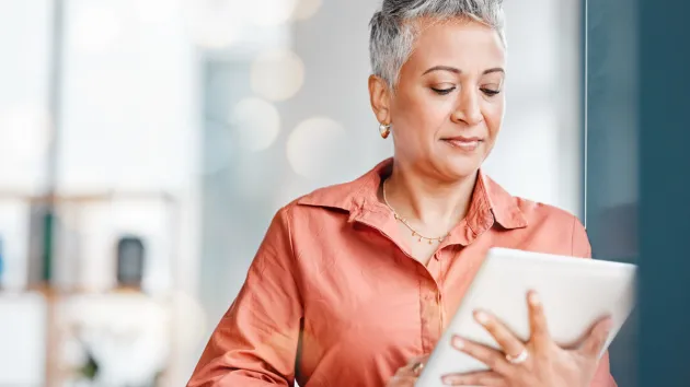 Female Business owner using a digital device 