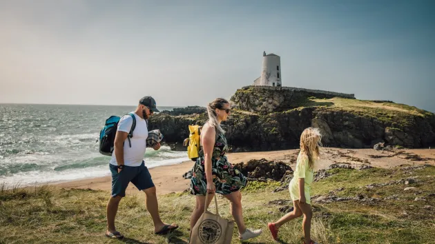 Family walking at Llanddwyn 