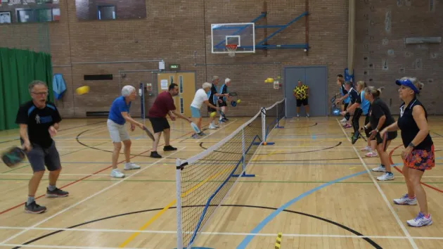 People playing pickleball