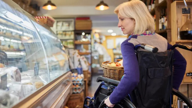 disabled shopper - wheelchair user in a shop 