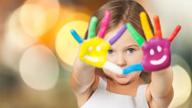 female child with painted hands