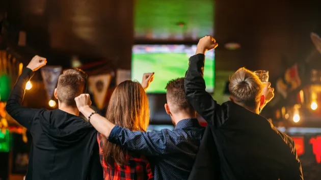 People watching football in a pub 