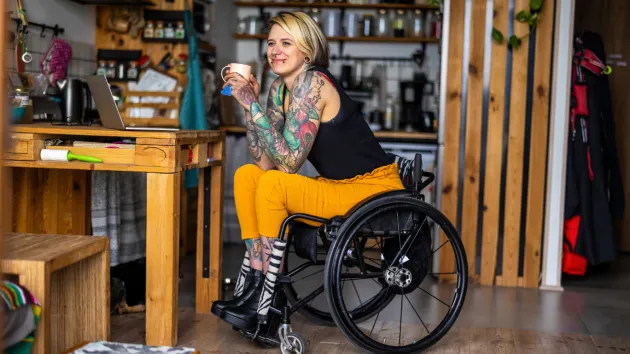 Wheelchair user in  workshop