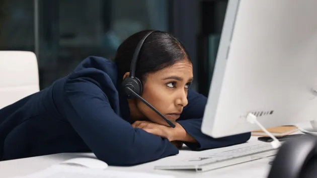 stressed female helpline employee