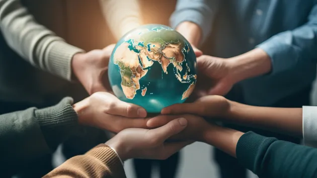 hands holding a globe