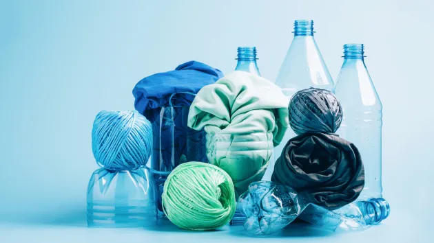 plastic bottles and clothes made from recycled products