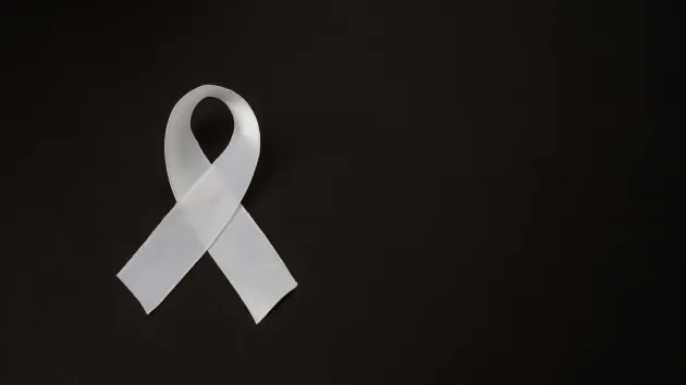 White ribbon on a black background 