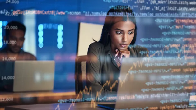 Woman using computer coding 