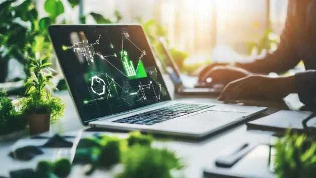 Laptop and net zero digital symbols 