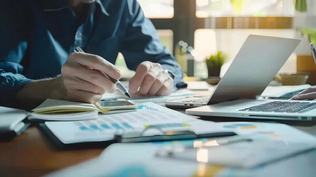 Person using a laptop to file accounts online