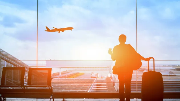 person waiting to travel at an airport 