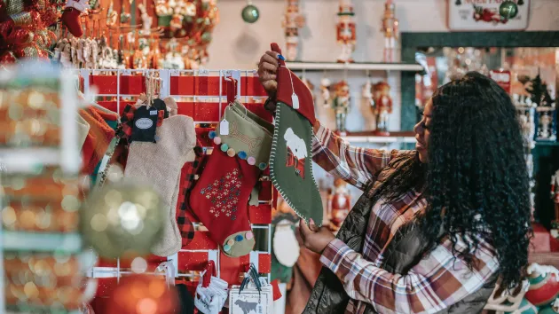 person looking at Christmas decorations