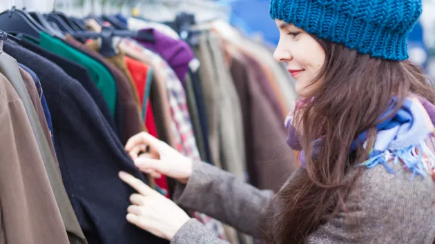 Woman choosing clothes at a market