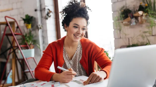 Person looking at a laptop - online learning 