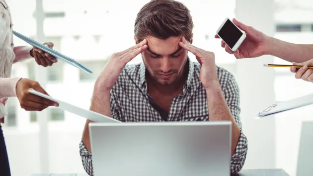 Businessman stressed out at work in casual office