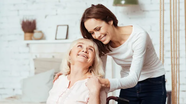 woman taking care of her disabled grandmother