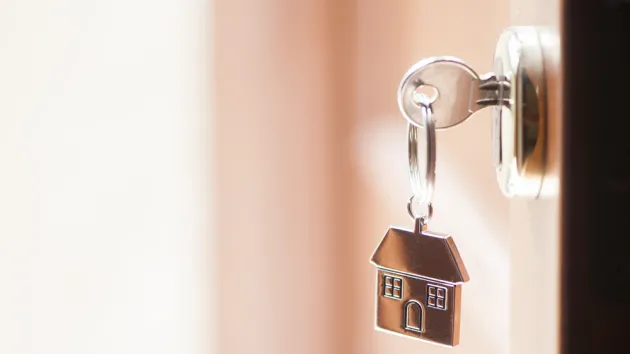 key in the door of a house