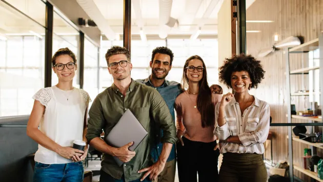 Diverse business people standing together at startup.