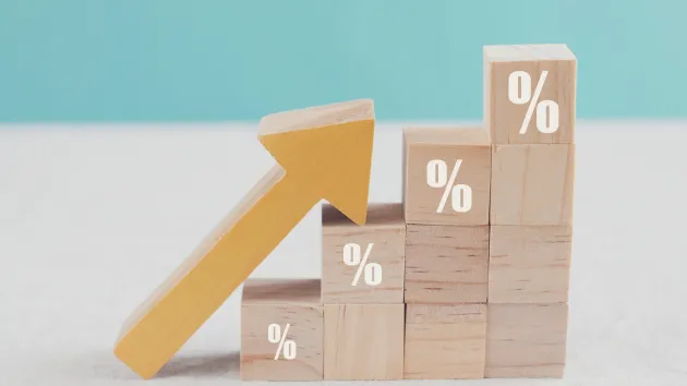 wooden blocks with percentage signs rising 