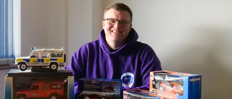 Man smiling with collectables 