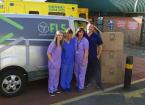 FLS staff and NHS staff in front of an FLS van.