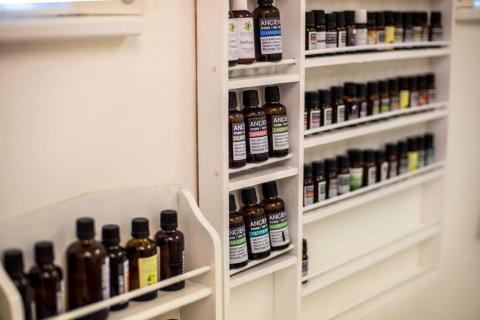 A shelf full of Aroma Oils products