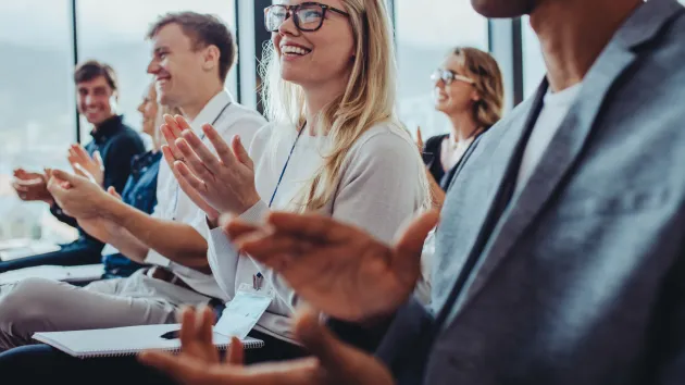 Business event, audience applauding 