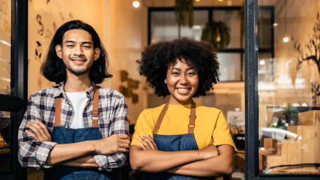 Social business owners smiling 