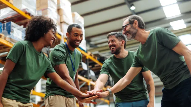 Happy employees working in a warehouse 