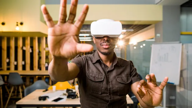 Immersive game, person wearing a gaming headset 