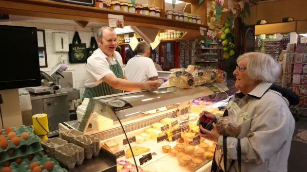 Wrexham Market - food stall with customers 