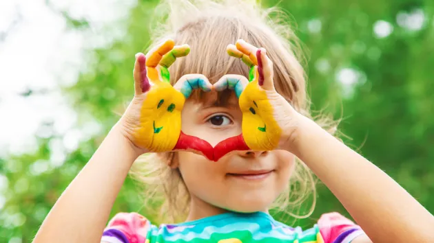 girl with painted hands 