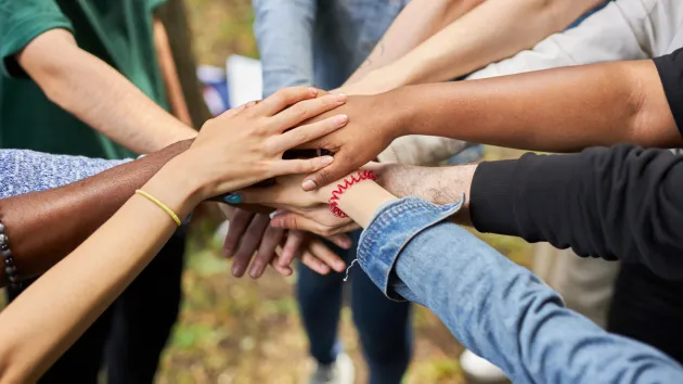 people holding hands 