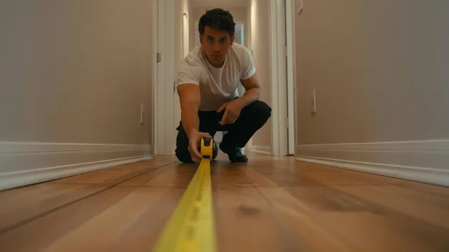 construction worker with a measuring tape