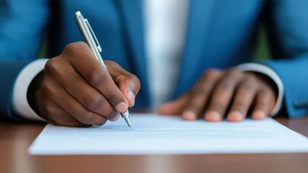 hands - person signing a business contract 