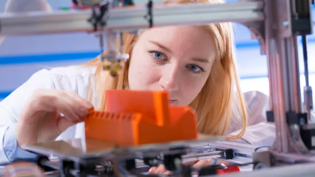 Person using a 3d printer