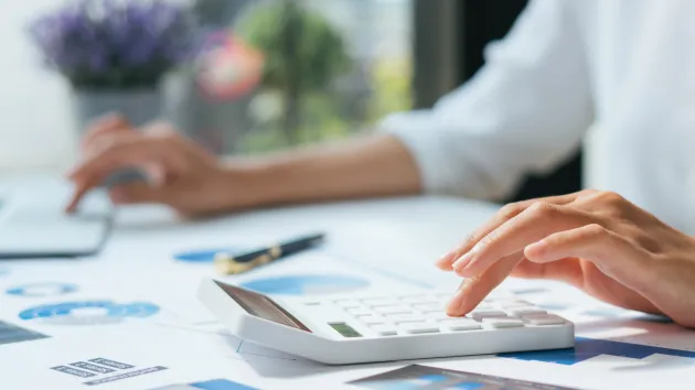 person using a calculator 