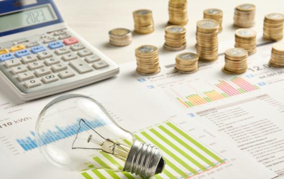 calculator, money and energy bills