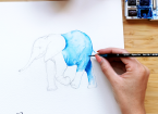 person painting an elephant