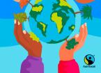 World being held up by hands Fairtrade logo