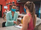 Person wearing a medical mask in a gym