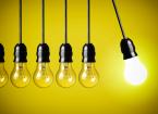 Idea concept on yellow background. Perpetual motion with light bulbs