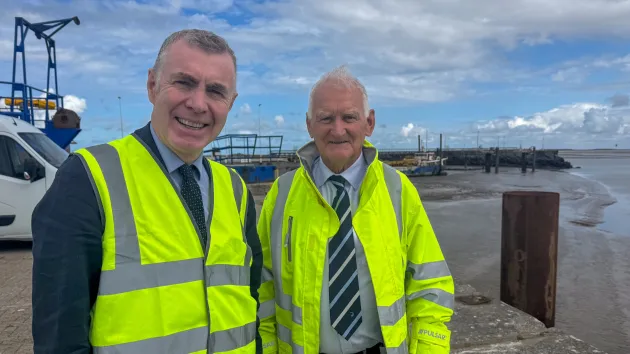 Cabinet Member for Enterprise, Connectivity and Energy, Adam Price with Jim O'Toole, Managing Director of the Port of Mostyn