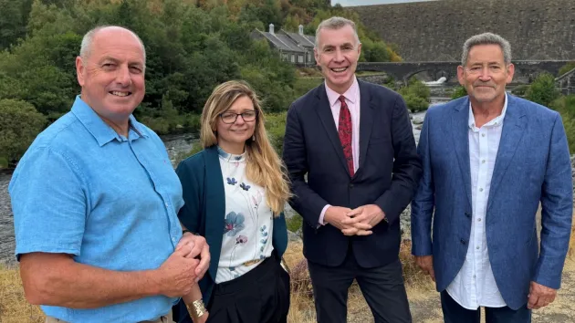 Cabinet Minister Adam Price with (from left) Steve Hughson MBE, Zoe Hawkins and George Reid