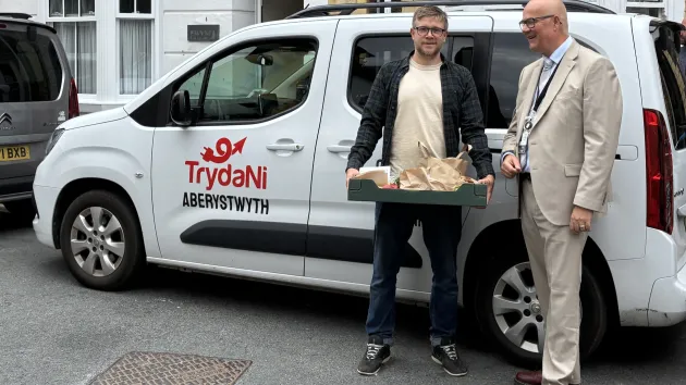 Deputy Minister for Transport Mark Hooper at the TrydaNi car sharing scheme in Aberystwyth