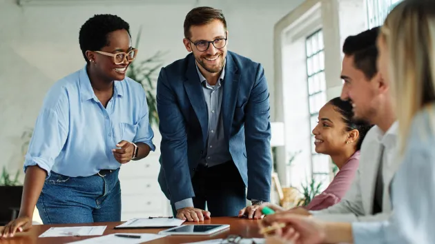 Entrepreneurs looking at a laptop