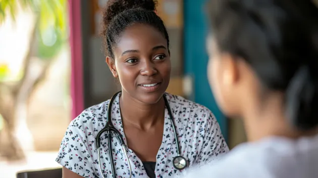 Health care worker checking the health of a worker 