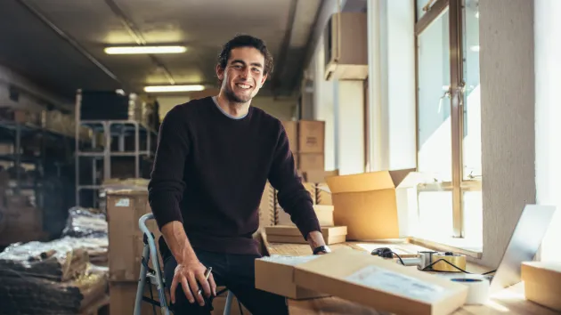 Small business owner smiling 