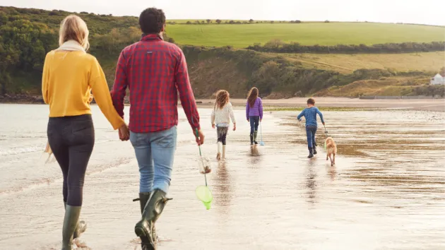 Family walking on a beach 